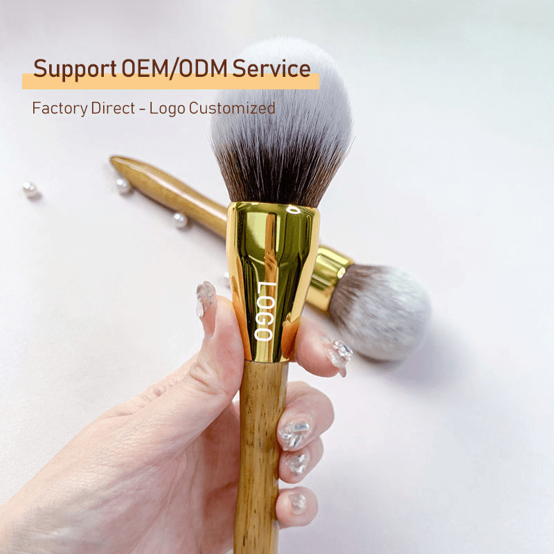 Single Makeup Brush With Golden Brown Wooden Handle And Gold Ferrule
